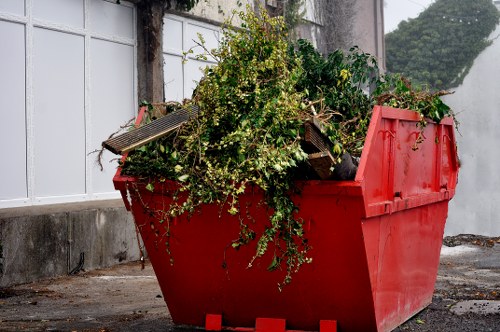 Professional removal crew handling furniture disposal in East London